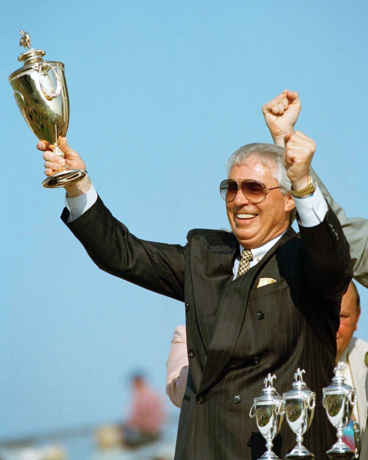 D. Wayne Lukas celebrating with a trophy — one of the great moments in American racing