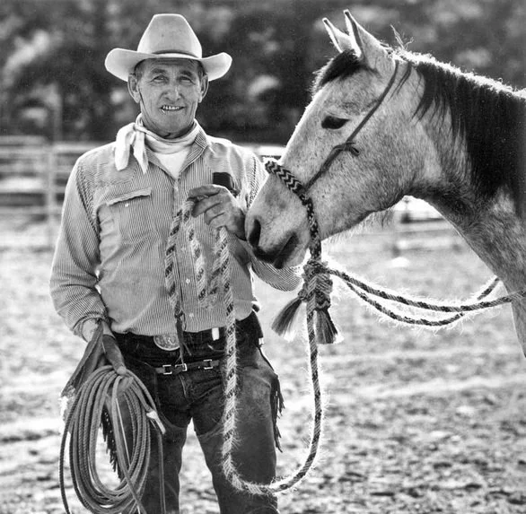 Ray Hunt — black and white portrait with horse and rope